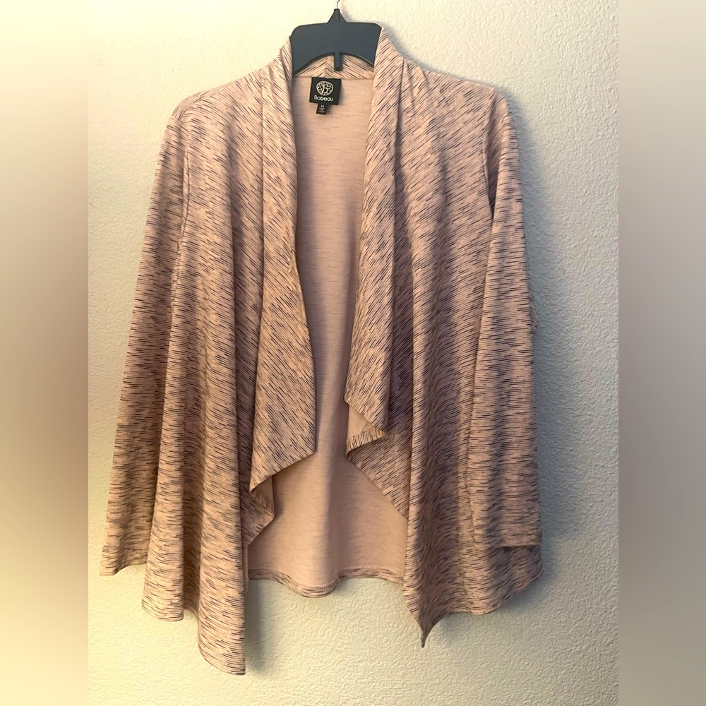New without tags. Size medium throw over can wear open or buttoned.